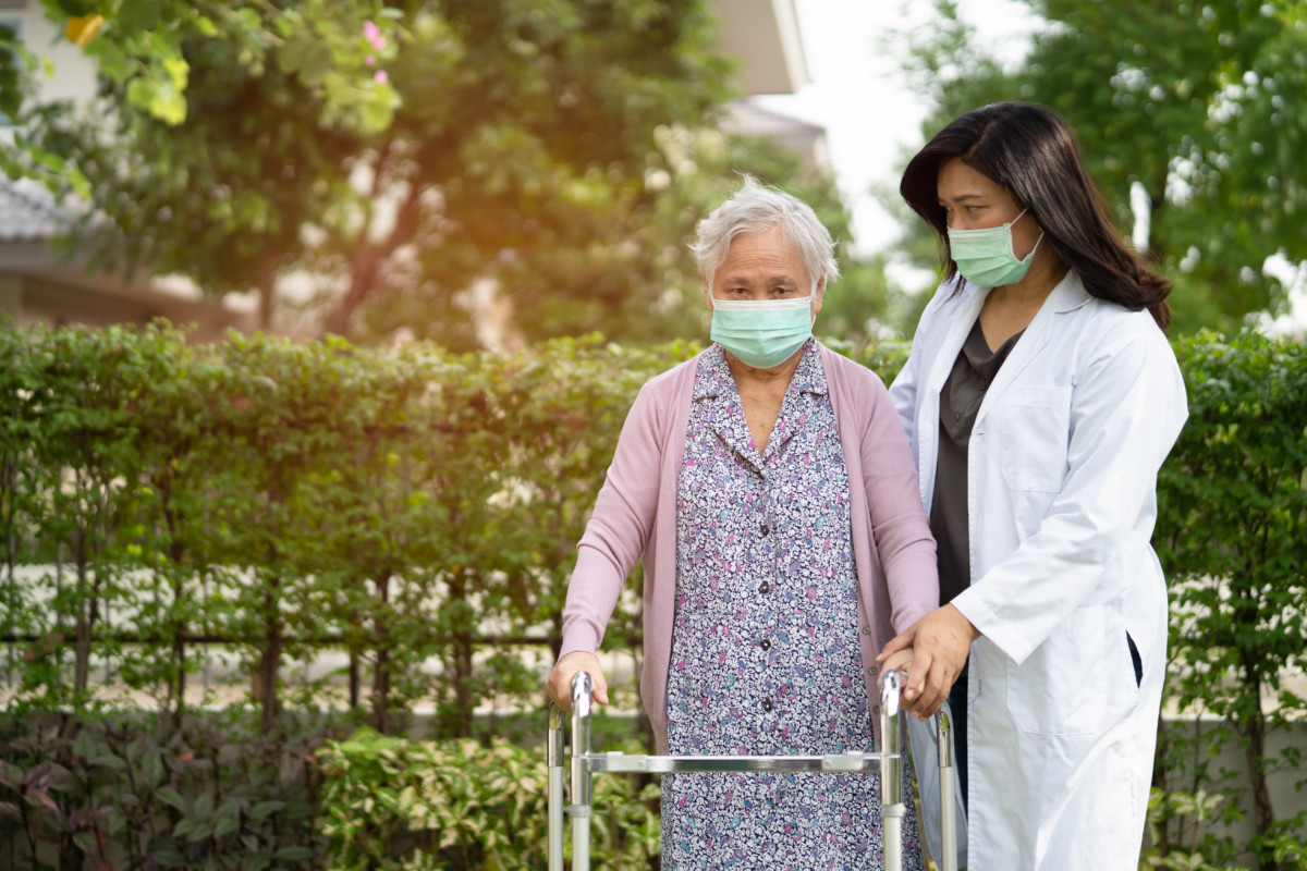 Physical Therapist Helping Elderly Patient