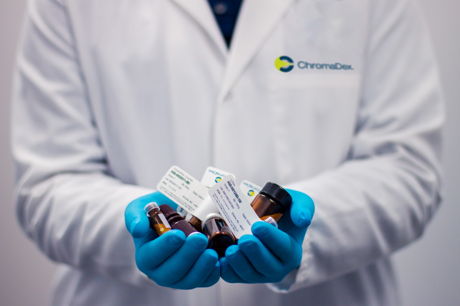 pharmacist holding medication